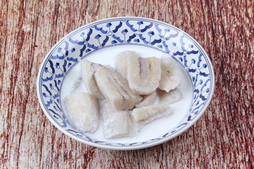 Ready served cultivated banana in coconut milk .