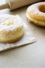 donut on paper texture with warm fall colors, soft-focus in the background. over light