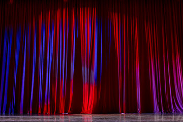 Red curtains and stage.
