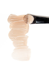 Liquid foundation and brush on white