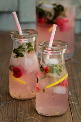 Fresh raspberry lemonade in bottles