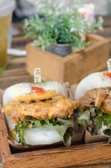 Delicious burgers bun with beef, tomato, cheese and lettuce