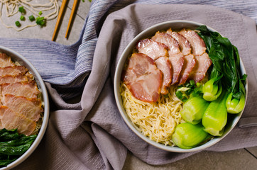 Egg noodle served dry with red roast pork, Chinese food