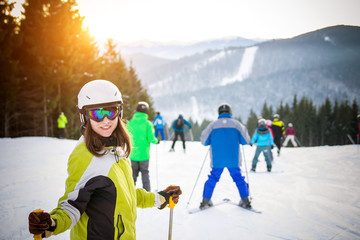 Young woman is skiing in mountains