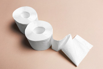 Toilet paper on pink background