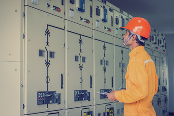 engineer working on checking status switchgear 