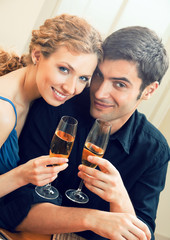 couple celebrating with champagne