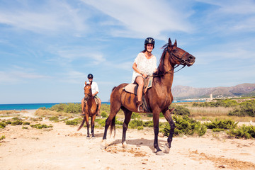 Young Tourist Couple Horseback Riding