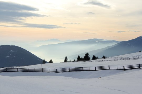 landscape from alpe di rodengo/rodeneck to isarco/eisack valley, wintertime in japanese patter style light, south tirol, italy