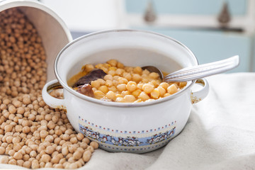 Chickpea stew  in a saucepan, spanish cocido
