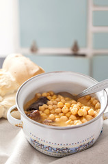 Chickpea stew  in a saucepan, spanish cocido