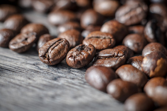 Coffee beans concept on wooden table background.