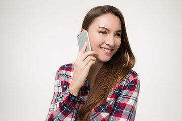 girl coquettishly talking on the phone and smiling