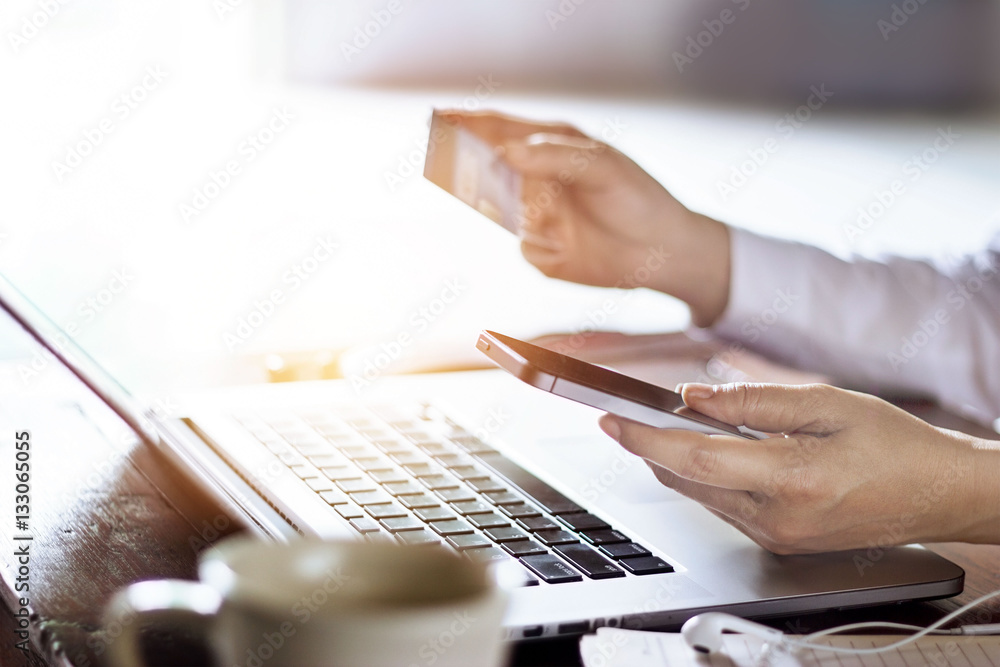 Poster man using mobile payments with credit card for online shopping online