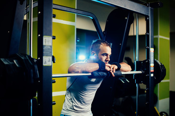 handsome fitness man weightlifting workout in gym