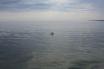Lonely fisherman on the ocean, Denmark
