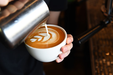 cup of latte art coffee for background