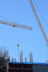 machinery crane working in construction site building industry