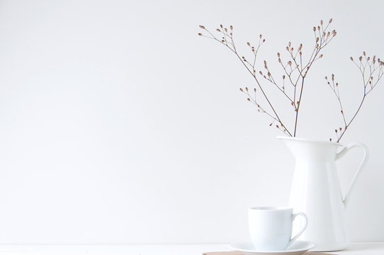 Minimal elegant composition with coffee cup and white vase