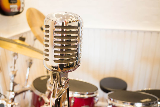 Vintage retro style microphone in music room