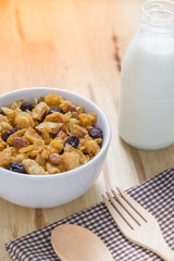 Corn flakes nutrition cereal and milk on wooden surface for healthy breakfast