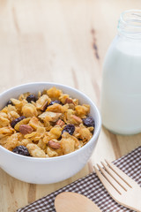 Corn flakes nutrition cereal and milk on wooden surface for healthy breakfast