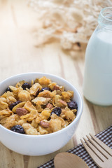 Corn flakes nutrition cereal and milk on wooden surface for healthy breakfast