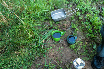 Camping cookware in the grass. Top view.