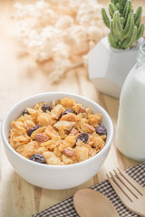 Corn flakes nutrition cereal and milk on wooden surface for healthy breakfast