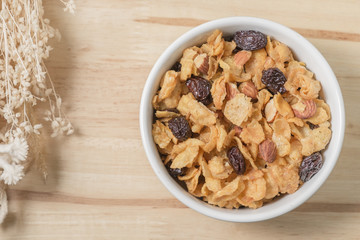 Corn flakes nutrition cereal and milk on wooden surface for healthy breakfast, Top view
