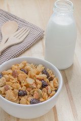 Corn flakes nutrition cereal and milk on wooden surface for healthy breakfast