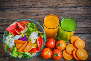 healthy foods are on the table, Fresh vegetable salad in a glass