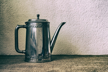 Food background with old antique iron kettle.