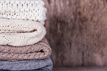 A stack of woolen sweater, plaid
