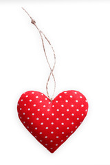Red spotted sewed pillow heart isolated on white background, valentine