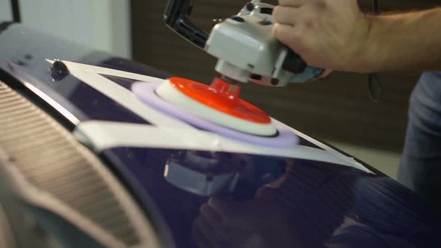 Polishing blue car with reflection, the concept car care
