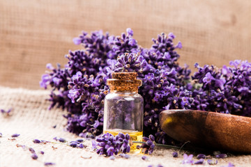 Obraz na płótnie Canvas Lavender flower, oil on wooden background, Nature Lavender product 