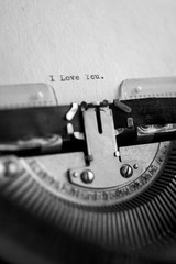 Message I love you printed on typewriter machine. Copy space on fiber paper.