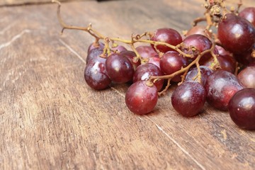 Grape red fresh Select focus with shallow depth of field on wooden table background