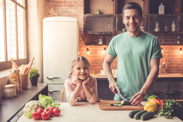 Father and daughter cooking