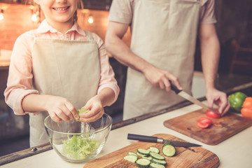 Father and daughter cooking