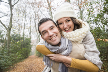 Fototapeta premium Young couple Walking Winter Woodland