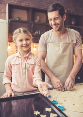 Fototapeta na wymiar Father and daughter baking