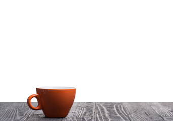 Orange cup on a table with isolated background