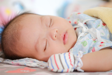 Newborn Asian baby girl sleeping