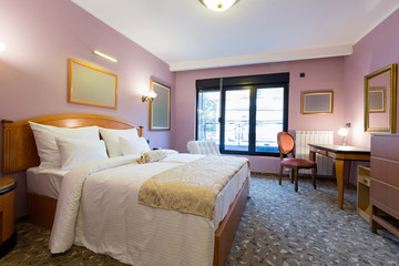 Interior of a new hotel double bed bedroom in the attic