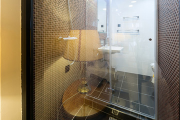 View to a bathroom through glass wall