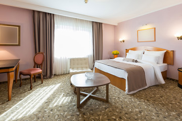 Fototapeta na wymiar Interior of a new hotel double bed bedroom