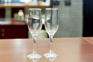 Empty champagne glasses on wooden table