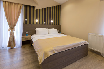 Interior of a new hotel double bed bedroom